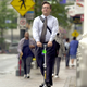 Don’t mind me! Just a morning commute in the year 2000: Larry Singer, then the state of Georgia’s chief information officer, rides his electric scooter through downtown Atlanta.
